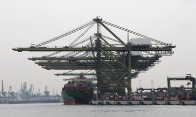 Container ship loading Photo by Manifold Times