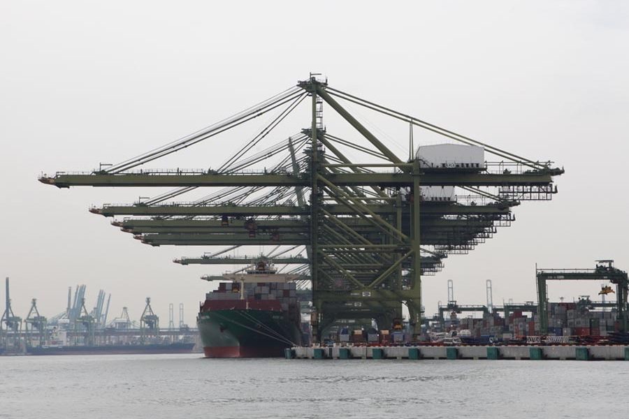Container ship loading Photo by Manifold Times