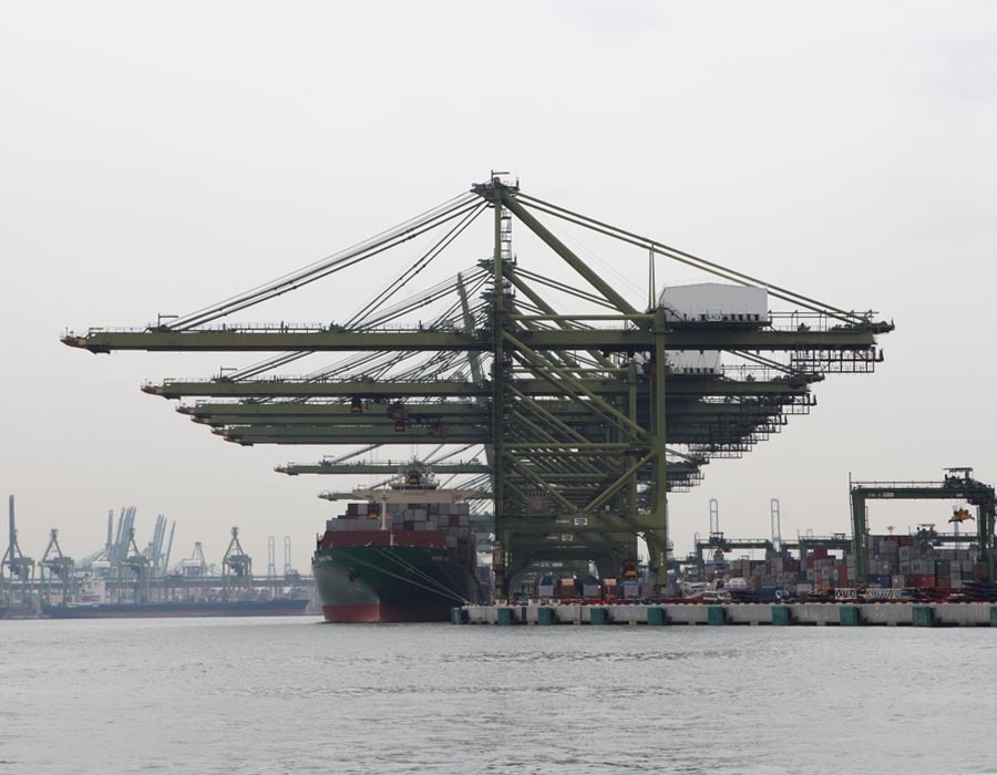 Container ship loading Photo by Manifold Times