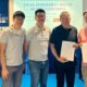 Co-founders of Green COP (left to right): Sng Yee Ching, Low Wang Chang, and Hanson Lee, stand alongside their angel investors (left to right), Teo Teng Seng, appointed as Chairman, and Desmond Chong, representing Ken Energy Pte. Ltd., holding the signed agreement, symbolizing the successful fundraising efforts and the unity of vision between Green COP and its investors.