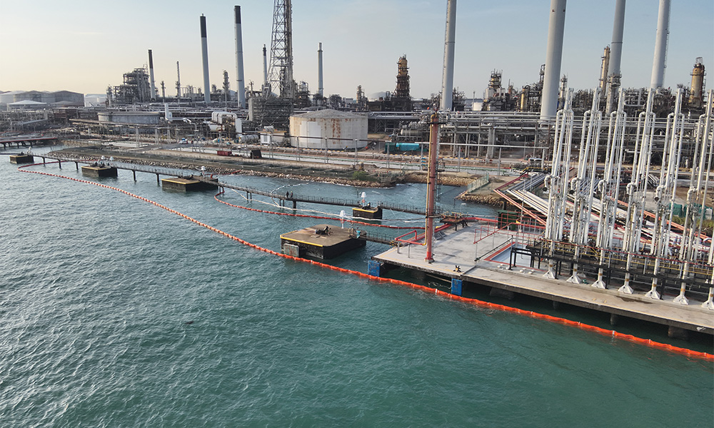 1 Containment booms deployed in the channel of Pulau Bukom taken on 28 Dec 9am