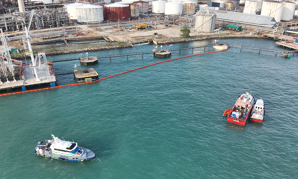 2 MPA craft (left) supporting Shell craft in the clean up operations of the oil sheens taken on 28 Dec 9am